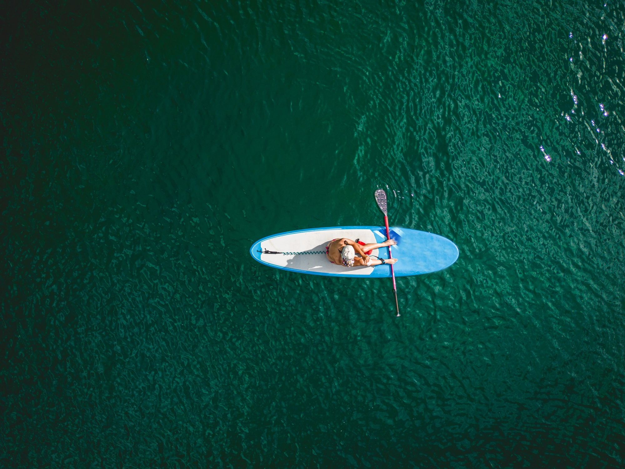 Aerial view of paddleboarding on a mountain lake